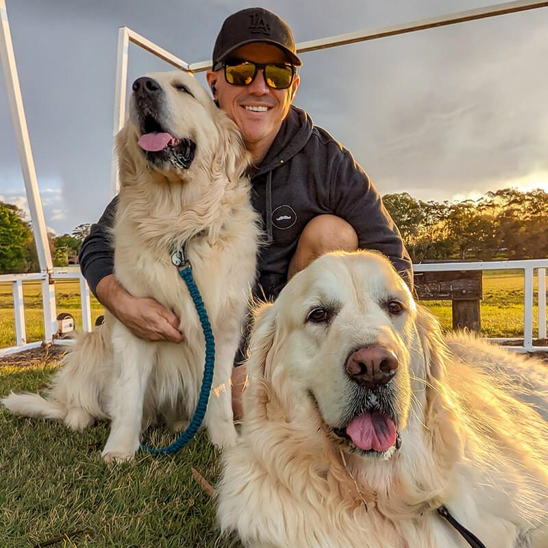 Chad Solomon with his golden retrievers